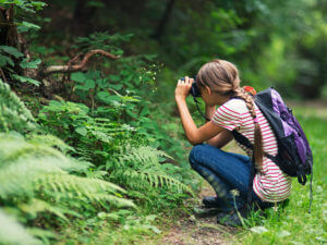 Girl taking on a path taking photos